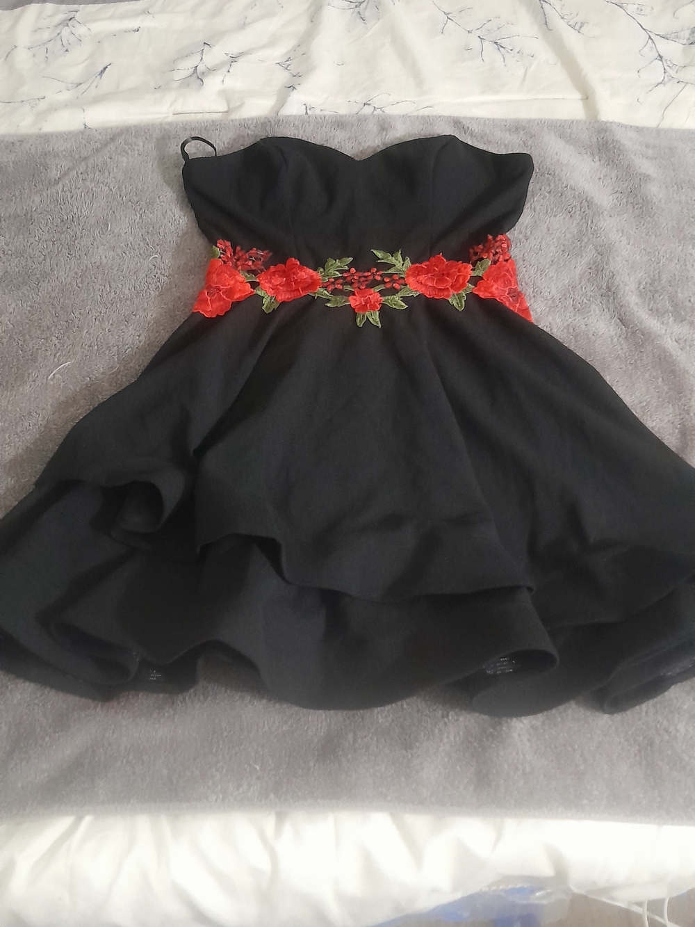 B. Smart Black Strapless Dress with Red Floral Waist Appliqué